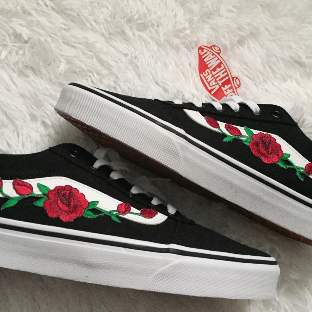 Black vans with red rose